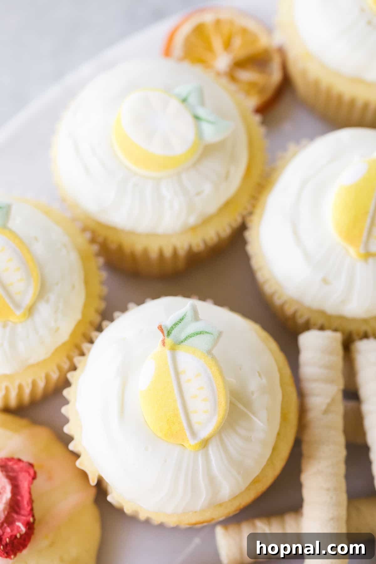 Spring Gatherings: A Lemon-Kissed Table 11 An array of exquisite lemon cupcakes and other lemon-themed desserts, tempting guests with sweet treats.