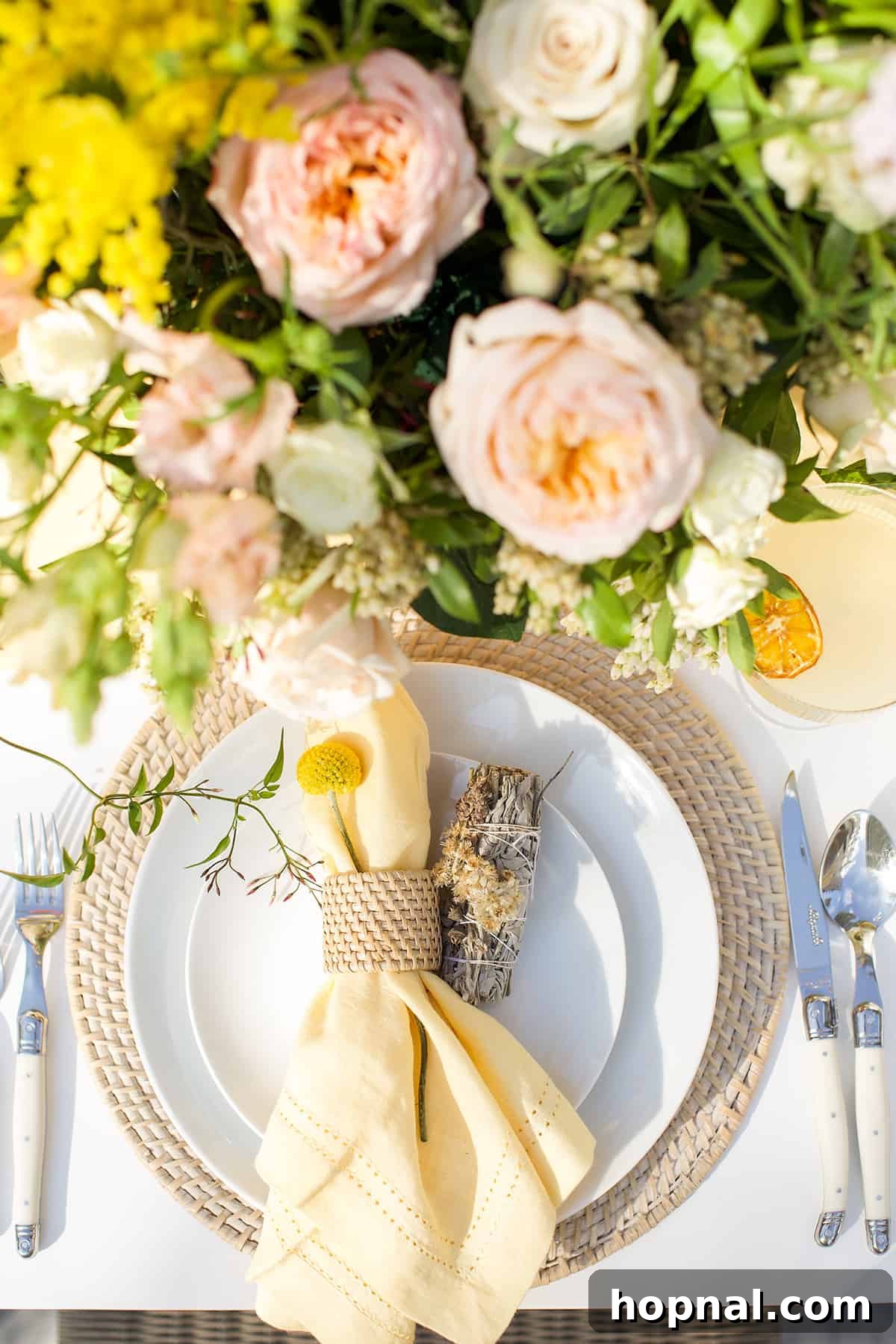 Spring Gatherings: A Lemon-Kissed Table 4 Elegantly set table featuring crisp white plates, yellow napkins, fresh flowers, and whole lemons as decor.