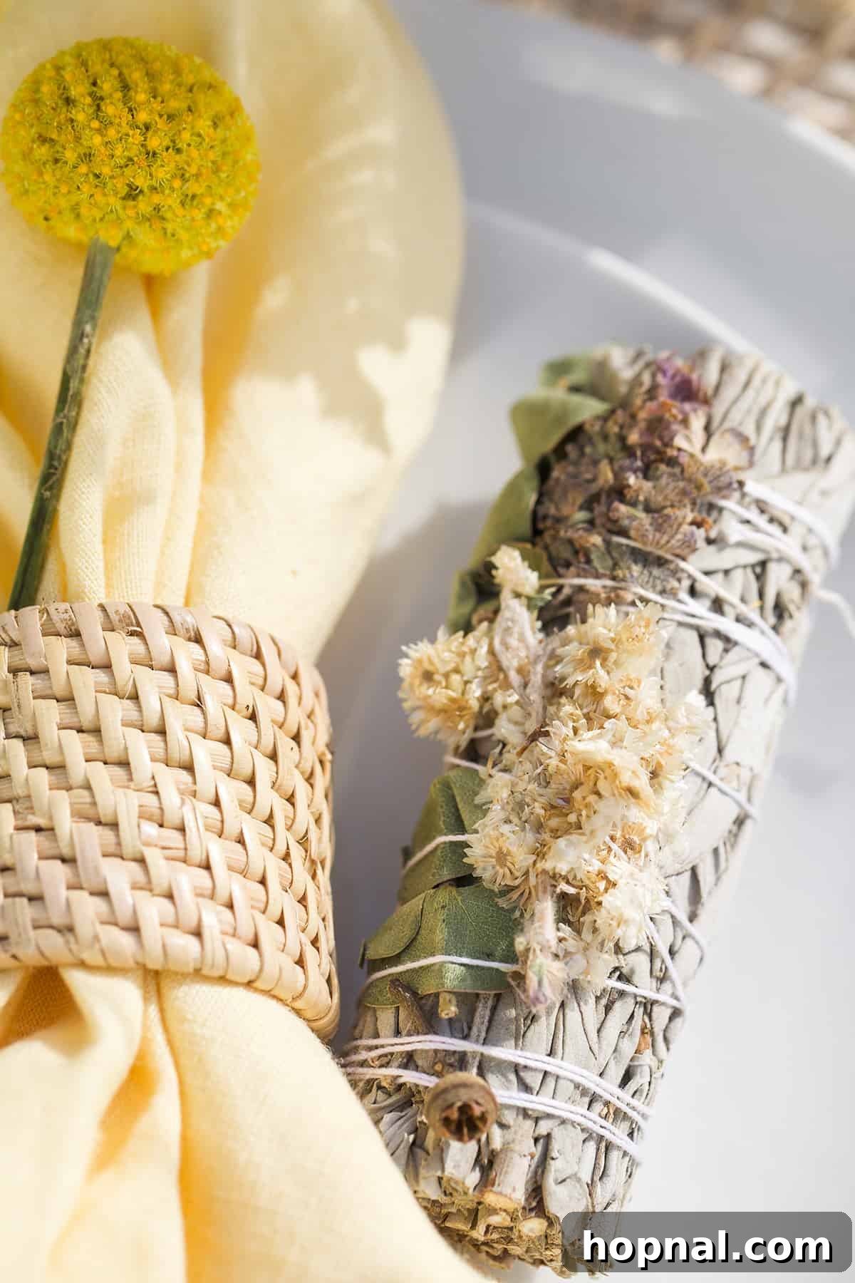 Spring Gatherings: A Lemon-Kissed Table 8 Close-up of sage bundles artfully placed on linen napkins, doubling as decor and a thoughtful party favor.