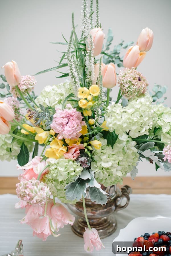 Mom's Garden Tea Oasis 11 Close-up of a vibrant floral arrangement featuring tulips and roses, perfect for a Mother's Day Backyard Tea Party