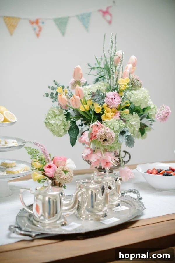 Mom's Garden Tea Oasis 9 Beautiful silver tea set surrounded by fresh flowers on a elegant tea party tray