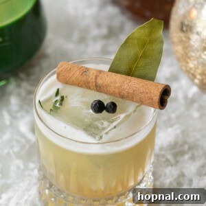 Whiskey sour made with a homemade honey syrup with herbs and spices.