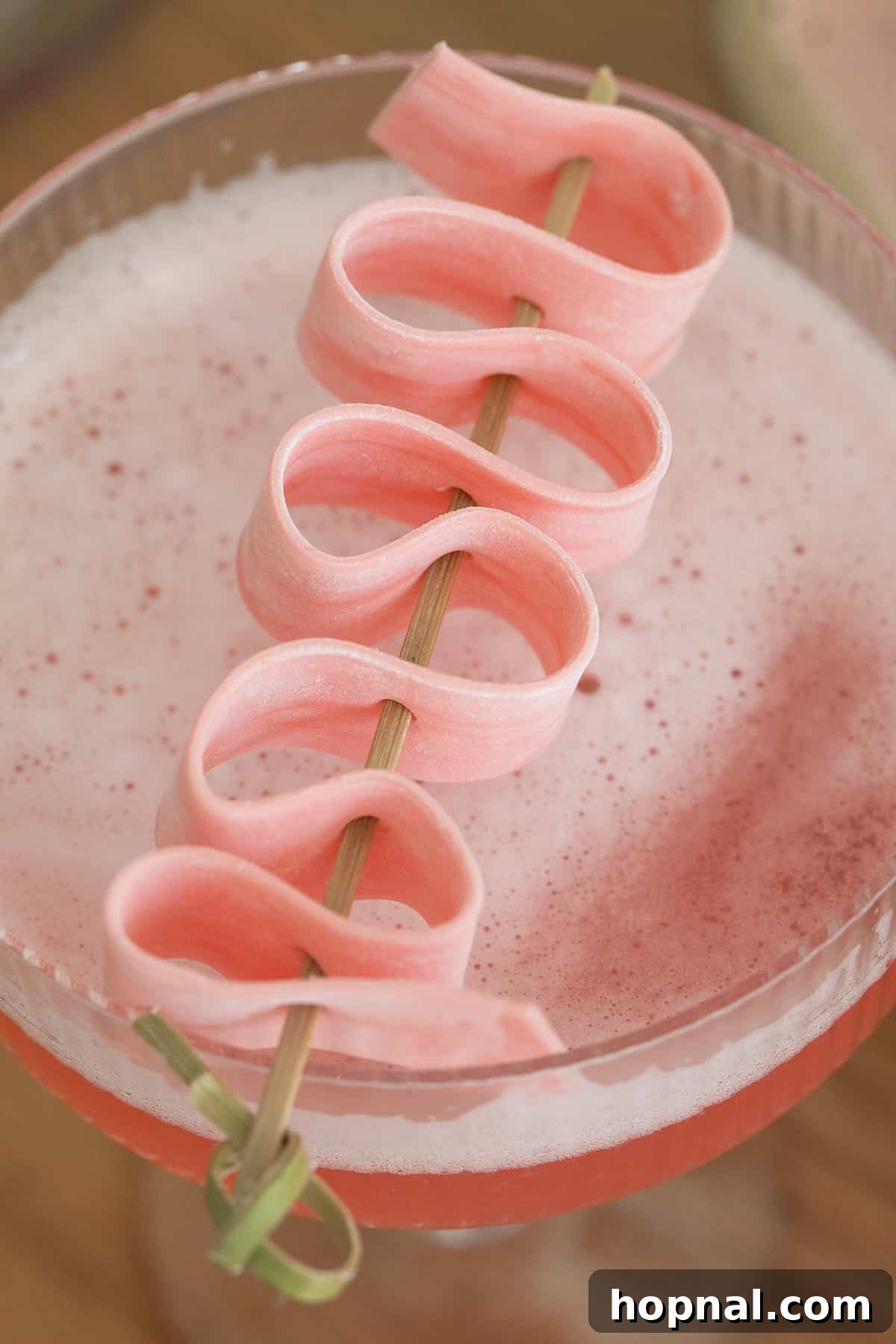 Bubblegum Bliss Vodka 3 Bubble gum cocktail with infused bubble gum vodka and a piece of bubble gum as garnish.