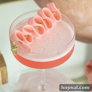 Bubble gum cocktail recipe with pink bubble gum garnish.