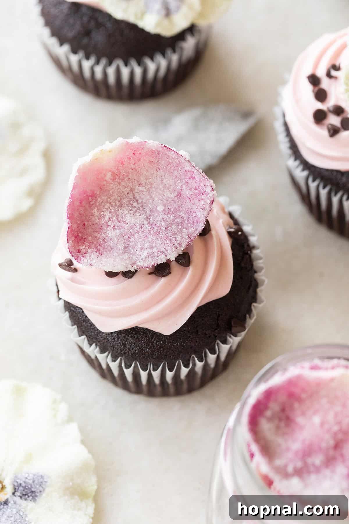 Sugared flowers on cupcakes.