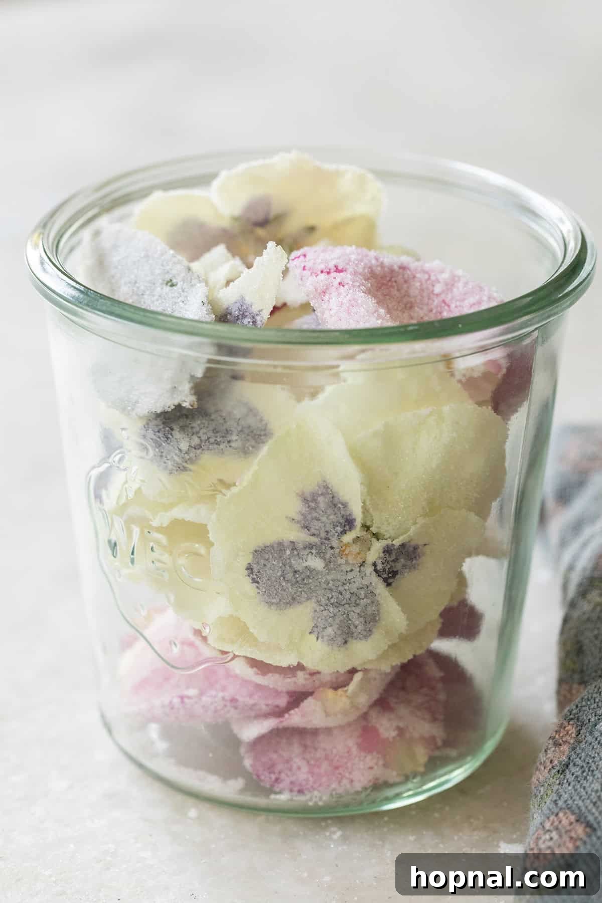 Jar filled with candied flowers.