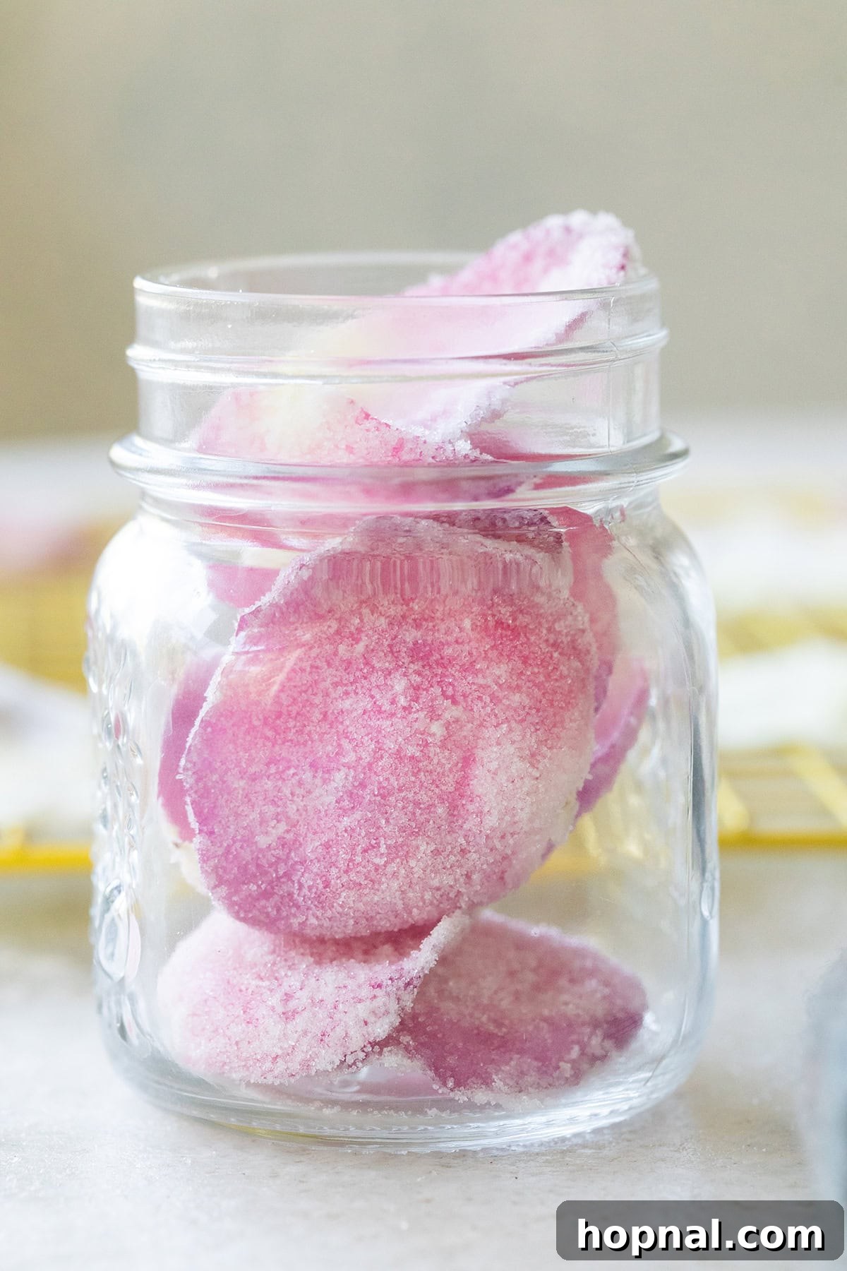 Rose petals, preserved with sugar and vodka in a jar.