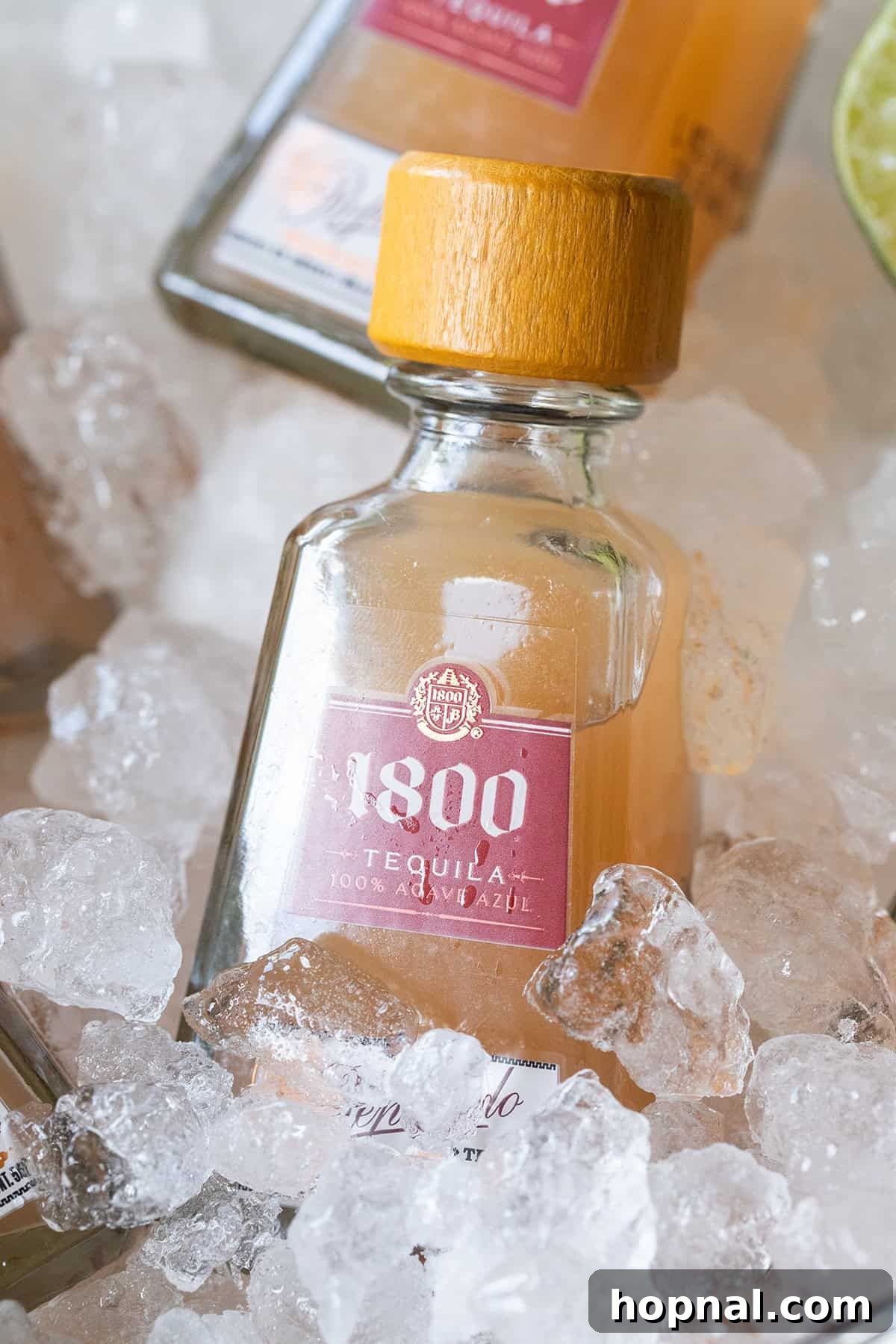 Mini Paloma Grapefruit Tequila Shots 4 Close-up of a mini Paloma shot, highlighting the beautiful color of the grapefruit juice and the small bottle presentation.