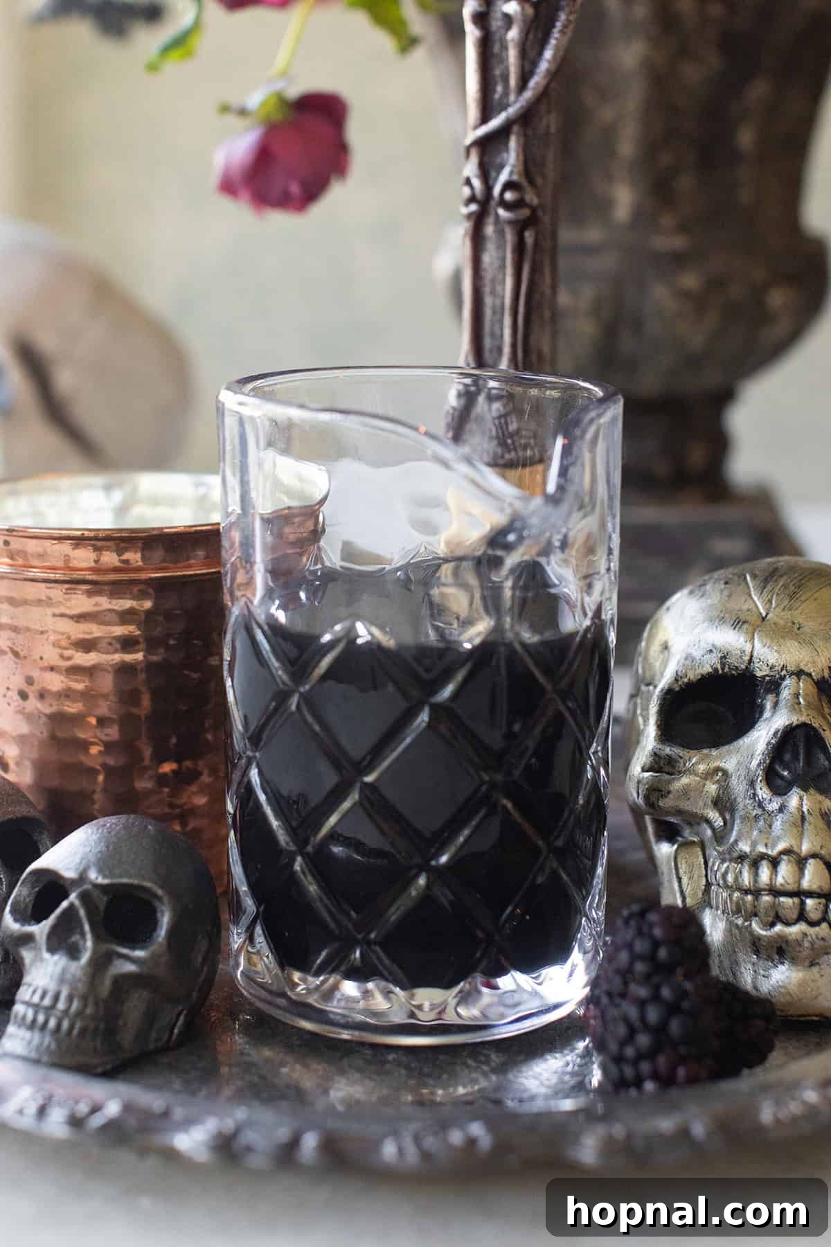 Black vodka in a clear jar, made by infusing vodka with activated charcoal.