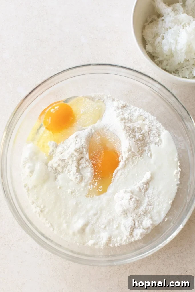 Coconut poke cake ingredients in a bowl.
