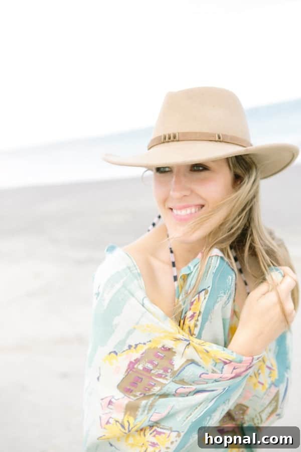 Eden Passante enjoying the sunny beach at Sullivan's Island with a stylish hat