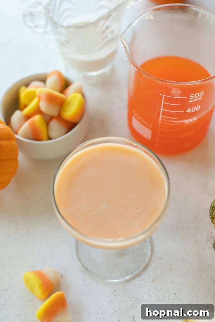 A freshly mixed Candy Corn Martini poured into a coupe glass.