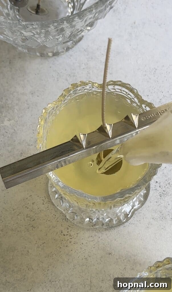 Pouring melted wax into a vintage glass candy dish.