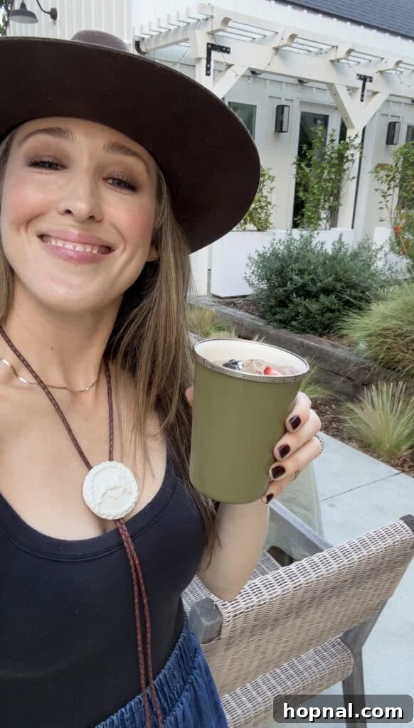 Rodeo-Themed Dinner Party Ideas: Menu, Decor & Tips 12 Eden Passante drinking ranch water out of an enamel green cup.