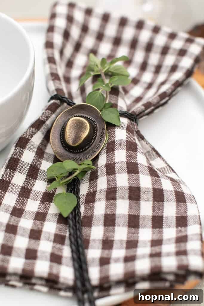 Rodeo-Themed Dinner Party Ideas: Menu, Decor & Tips 8 Cowboy hat napkin ties around a checkered napkin.
